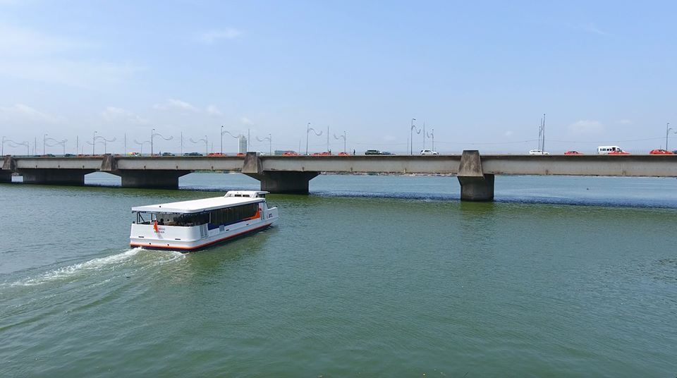 A water bus crossing the Ébrié Lagoon, Abidjan