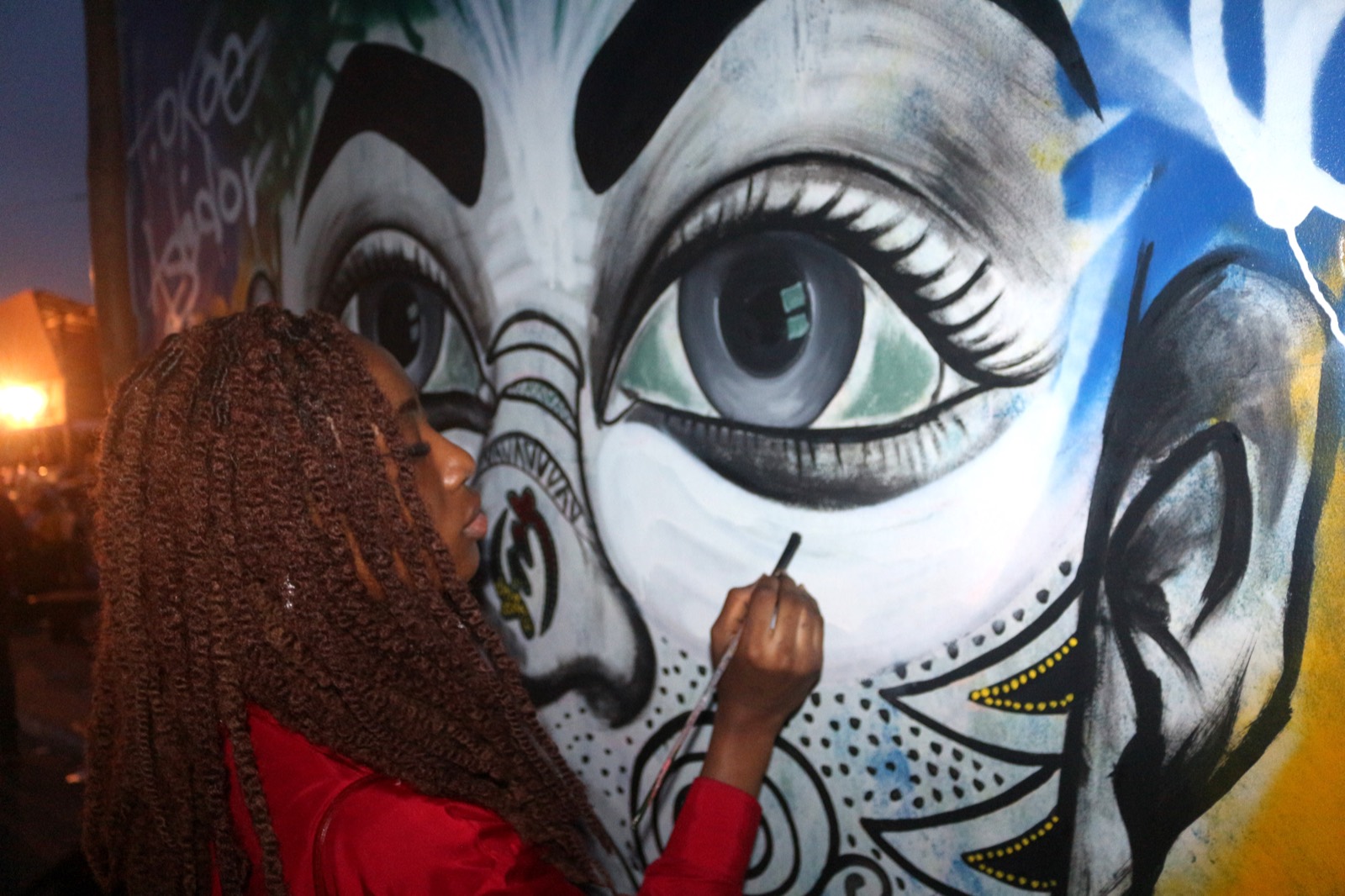 Painting a mural at the Chale Wote festival, Accra